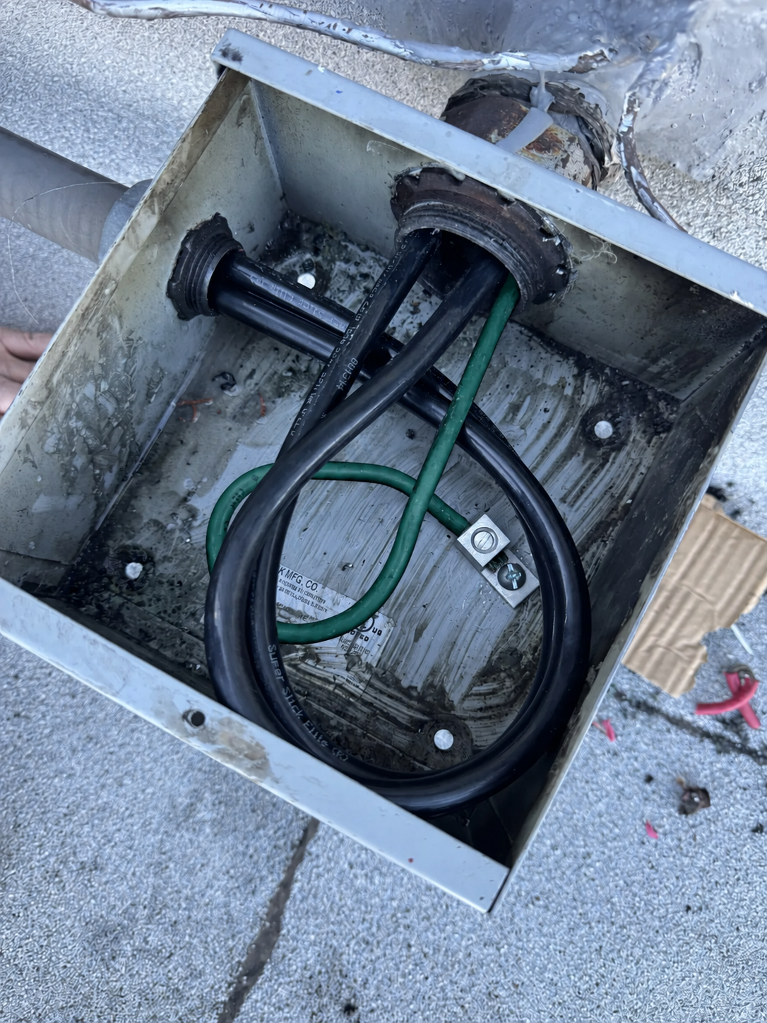 Electrical service enclosure with conductors and conduit connections